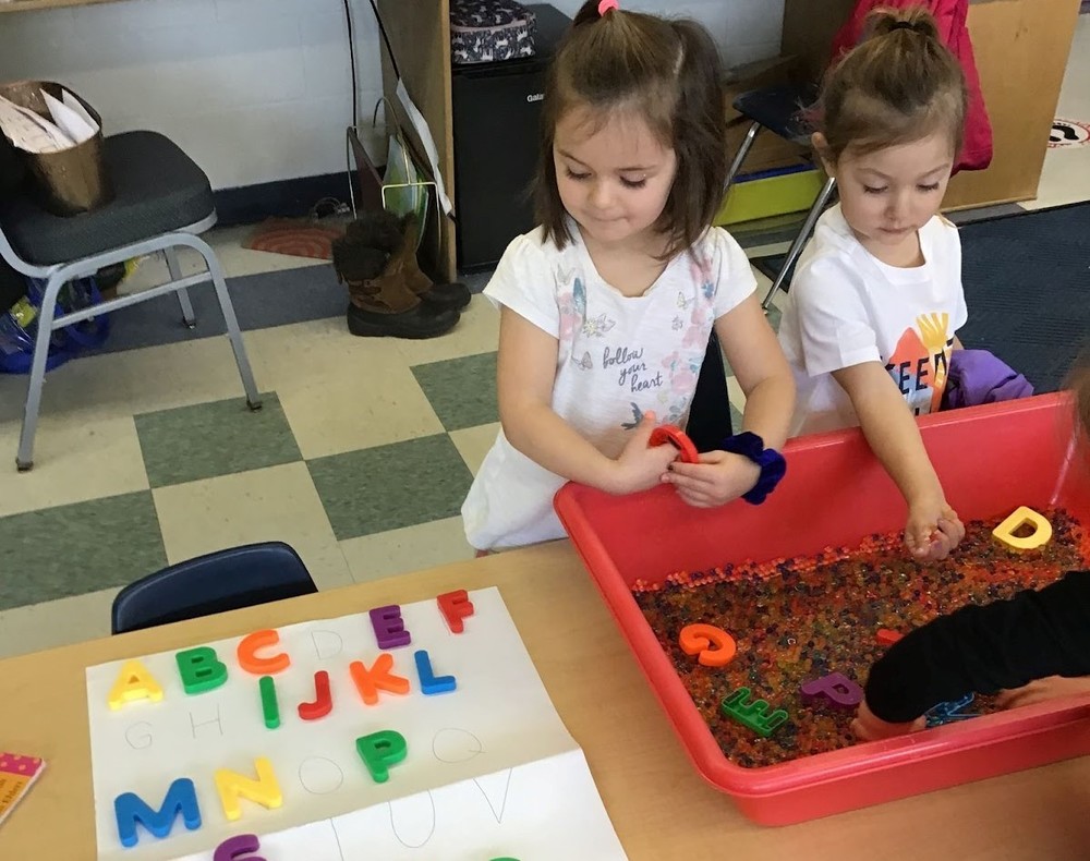 FES Preschoolers playing with water beads & alphabet letters